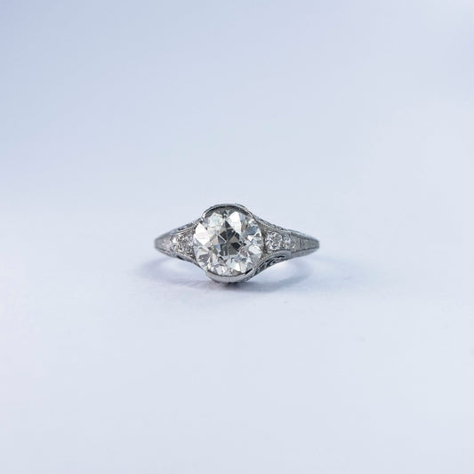 1920s Platinum Filigree Ring with Bezel Set Diamond