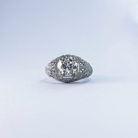 1920s Platinum Round Cut Diamond Ring with Extraordinary Filigree and Diamond Inlay
