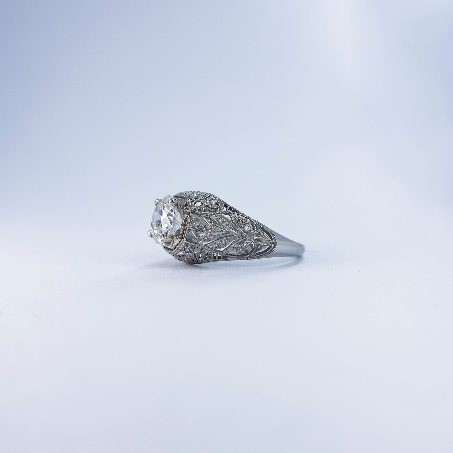 1920s Platinum Round Cut Diamond Ring with Extraordinary Filigree and Diamond Inlay