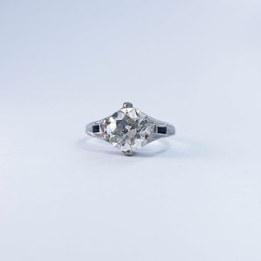 1920s Art Deco Old European Round Cut Diamond and French Cut Sapphire Ring in 20K White Gold