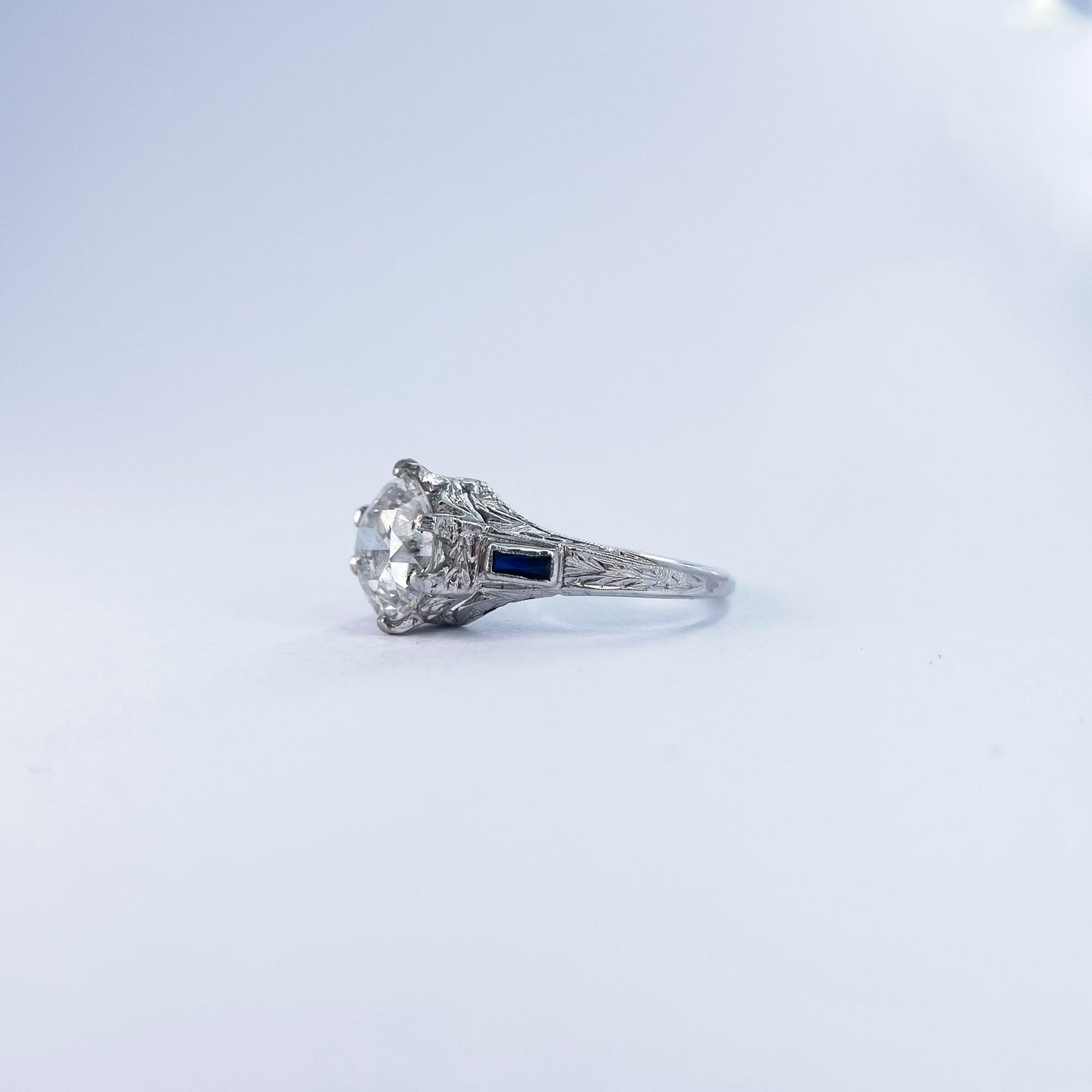 1920s Art Deco Old European Round Cut Diamond and French Cut Sapphire Ring in 20K White Gold