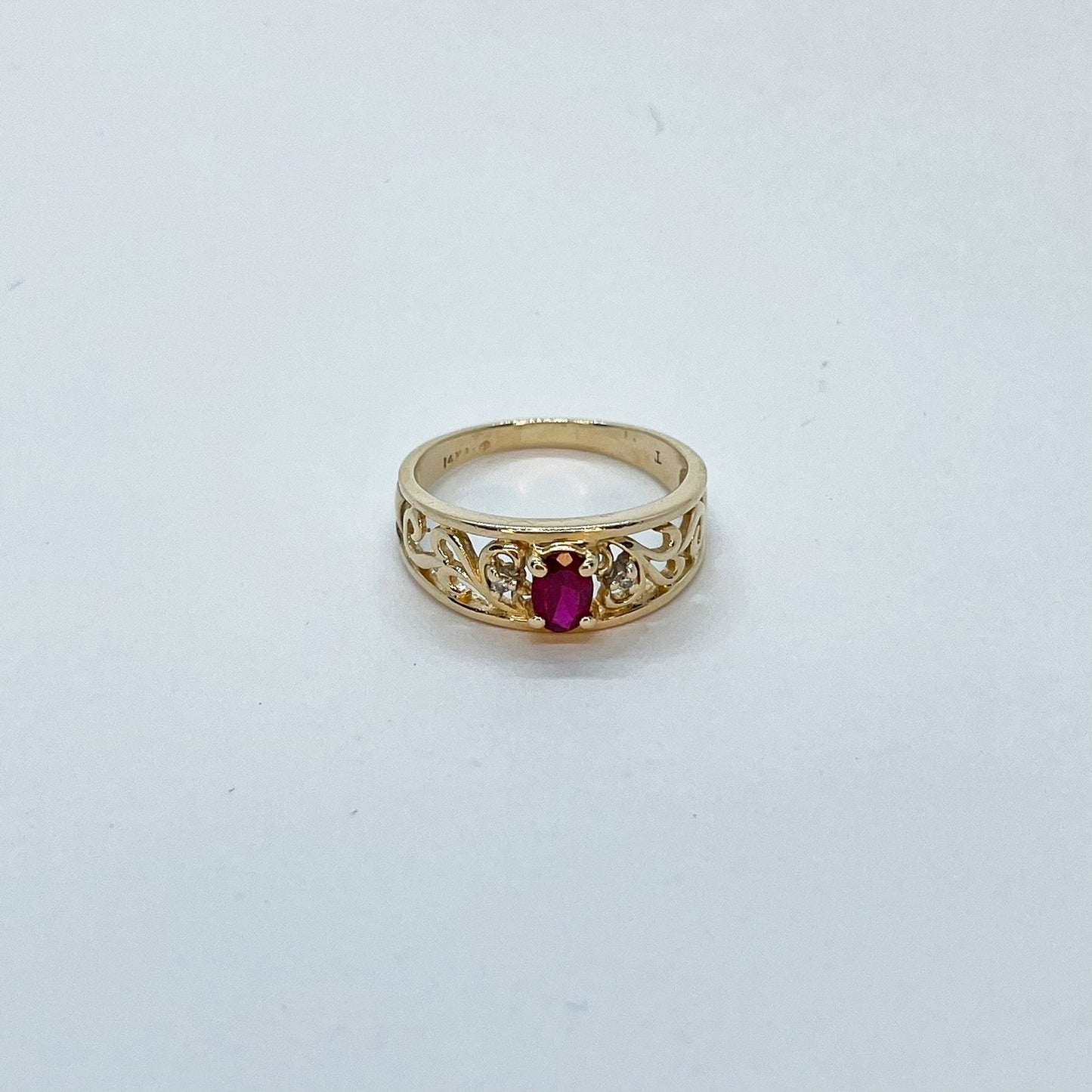 14K Oval Cut Ruby with Ornate Gold Band Design