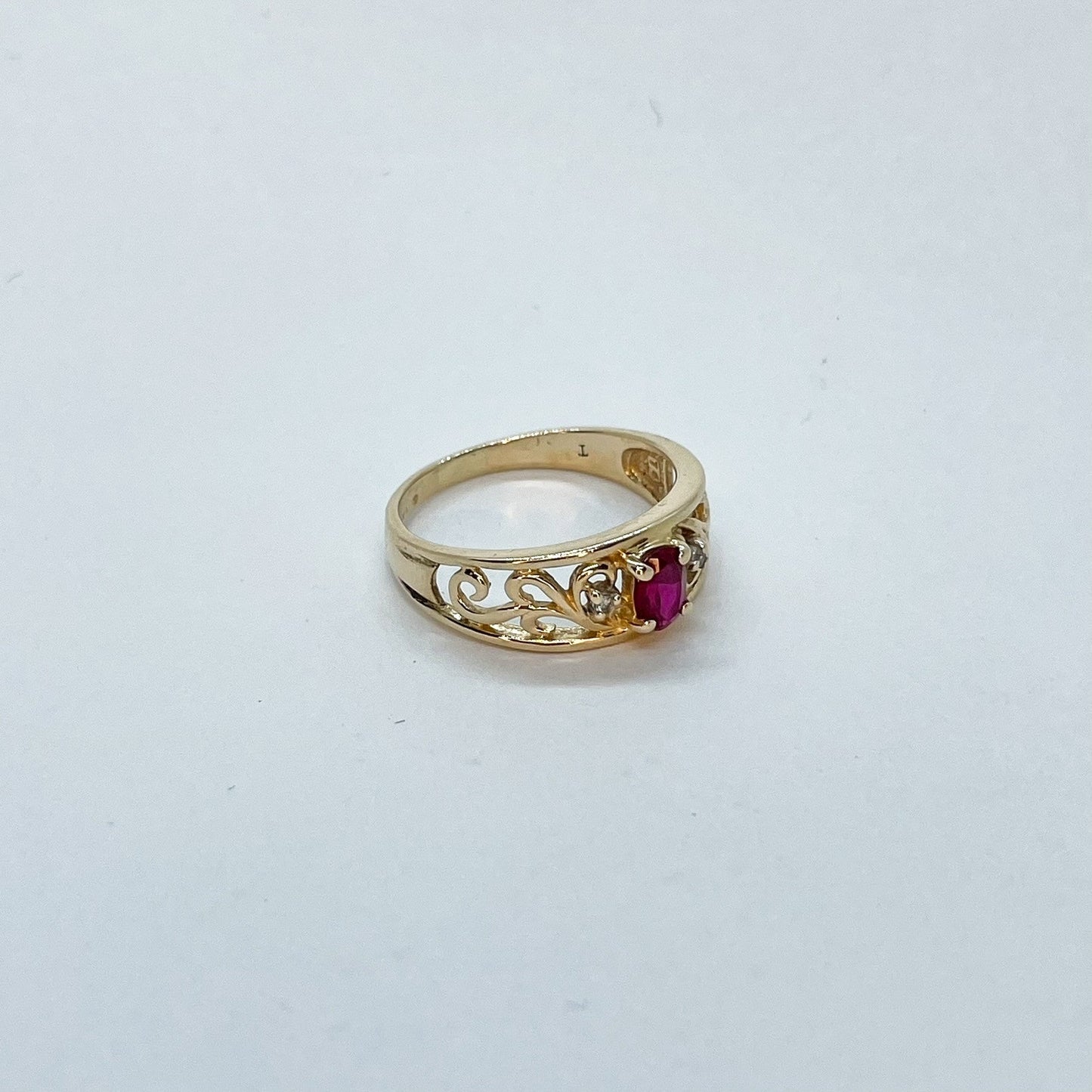 14K Oval Cut Ruby with Ornate Gold Band Design